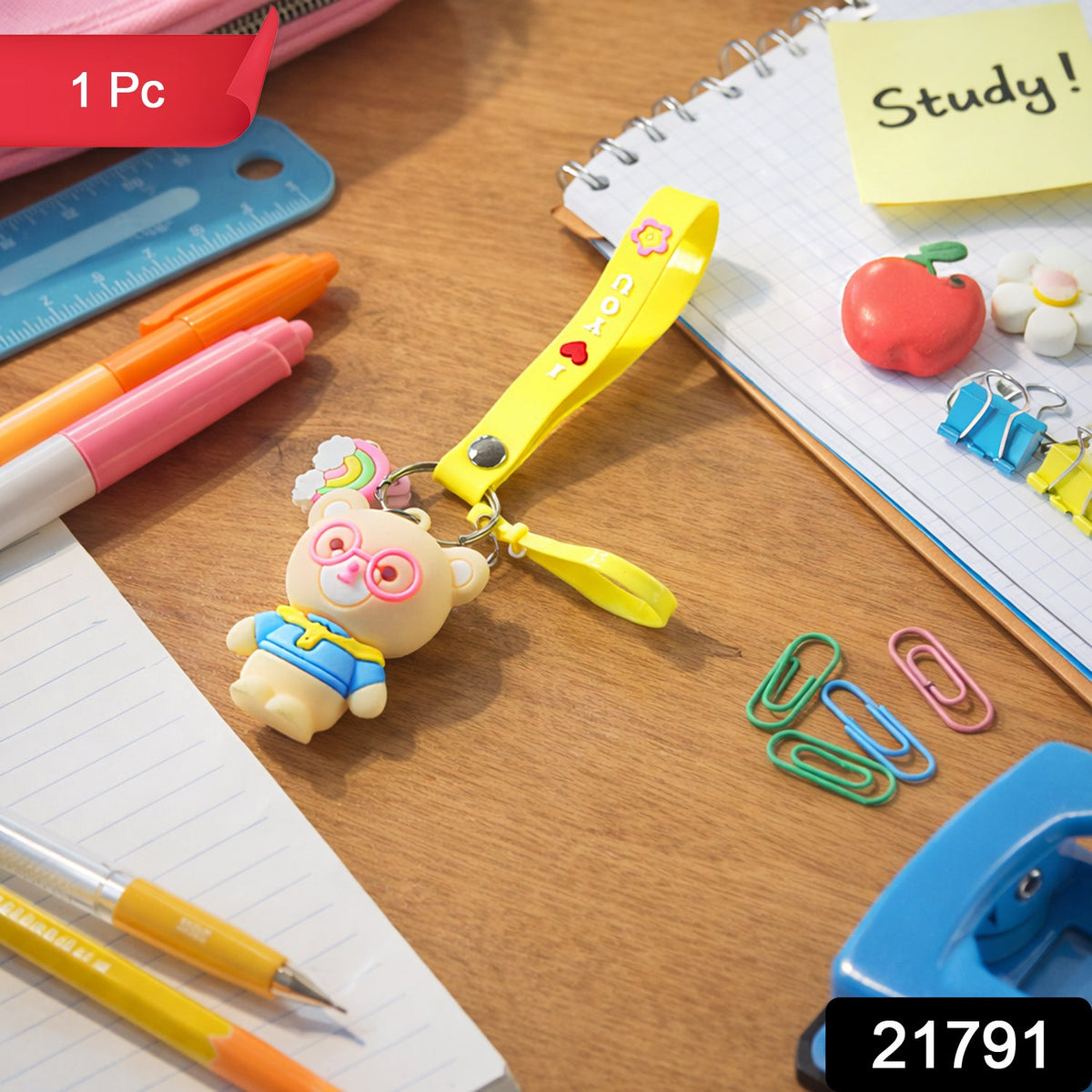 Close-up of teddy bear keychain showcasing cartoon design and vibrant yellow silicone loop strap