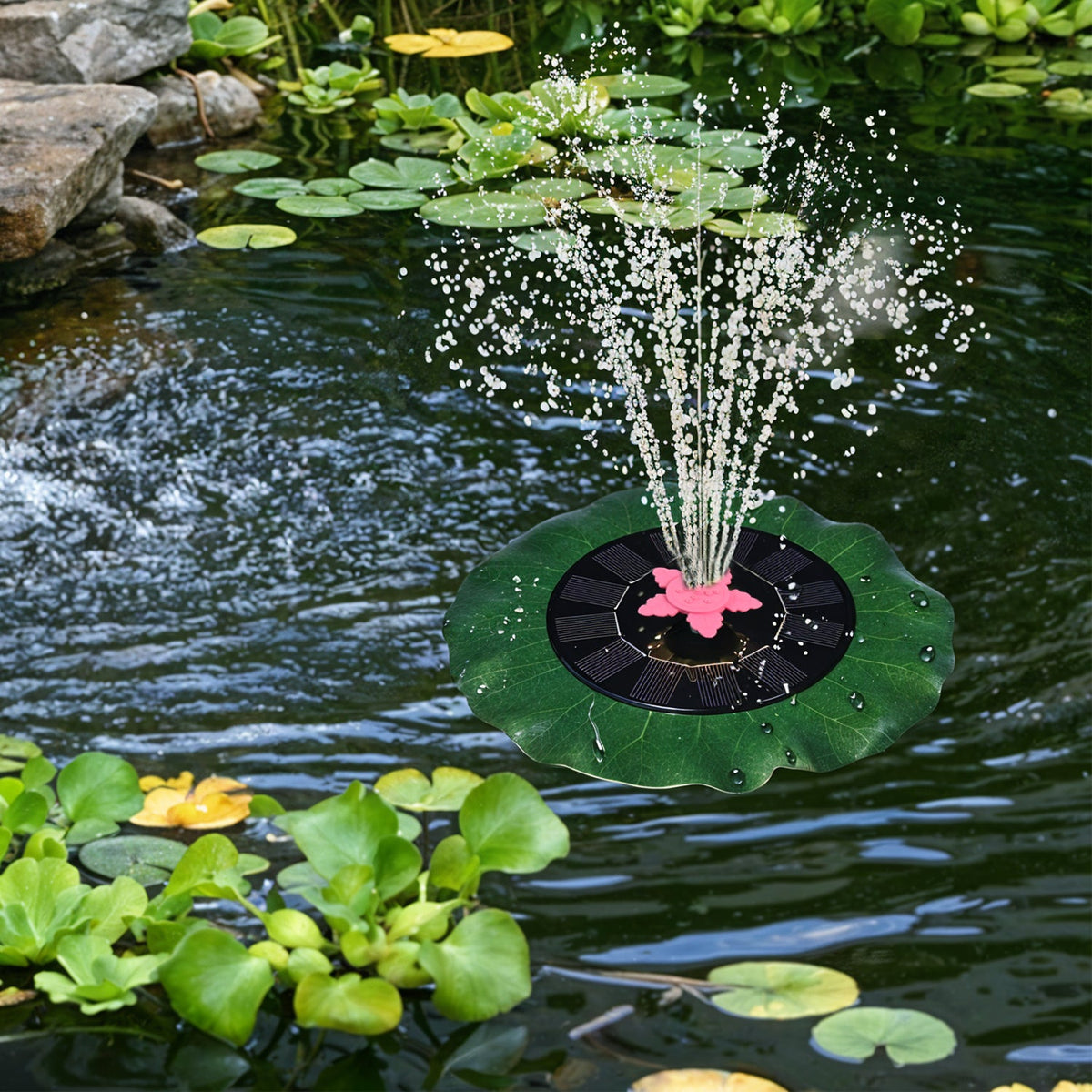 Decorative solar-powered floating water fountain pump placed on water surface