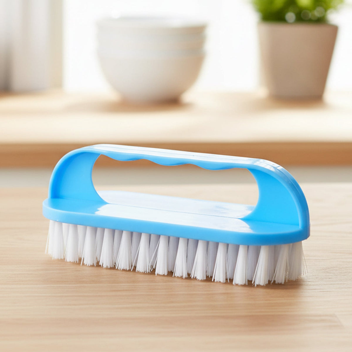 Top view of handheld cleaning brush showing durable build and sturdy bristles.