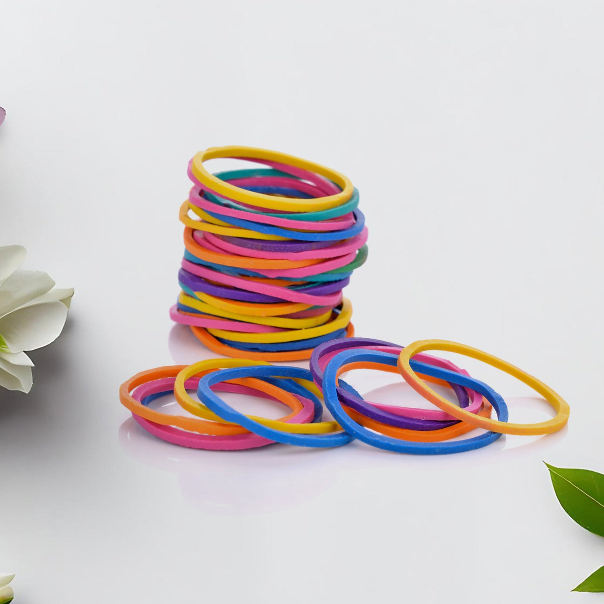 Assorted multicolor elastic bands for office, kitchen, and school supplies.
