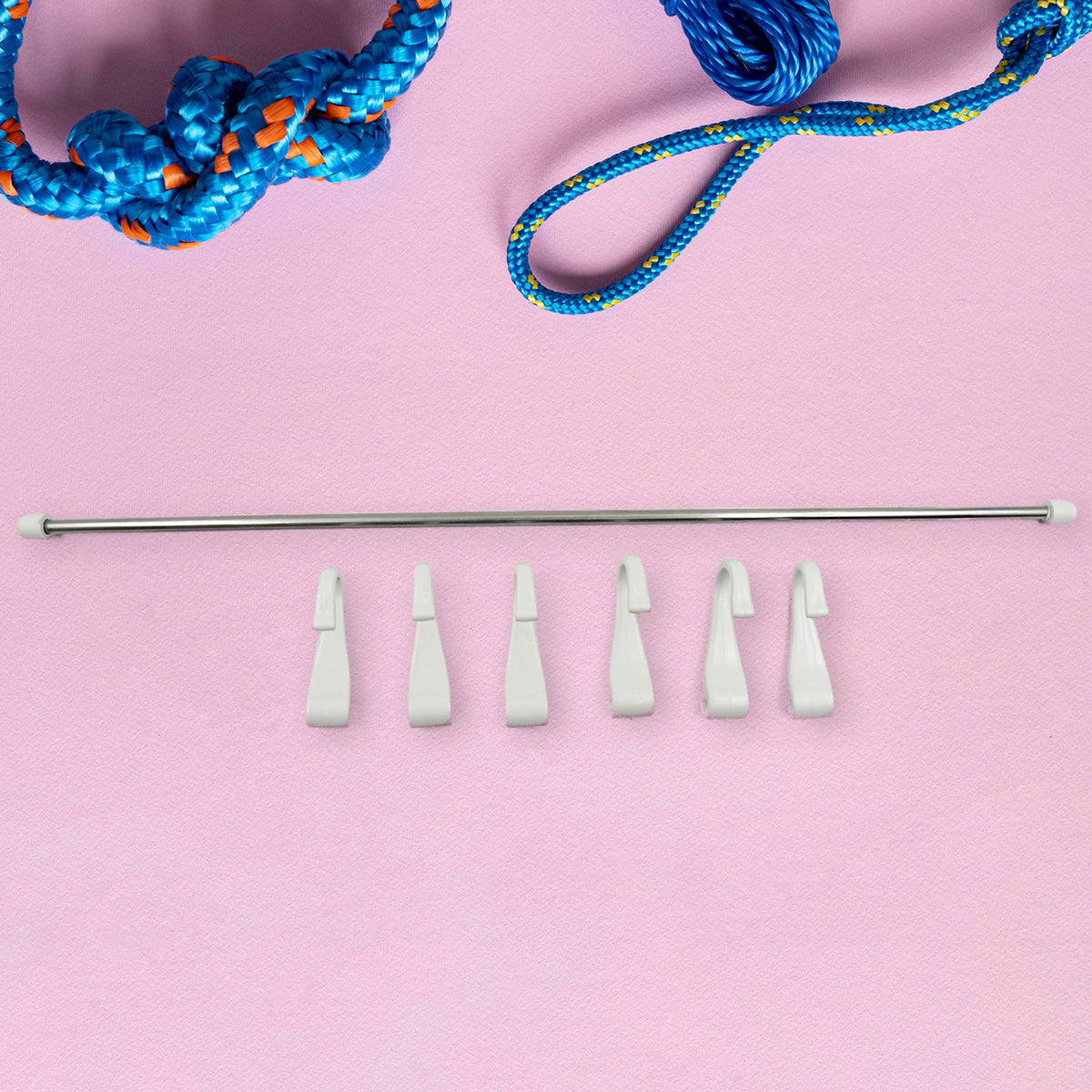Detail shot of the durable plastic hooks easily sliding onto the stainless steel rod of the hanger.