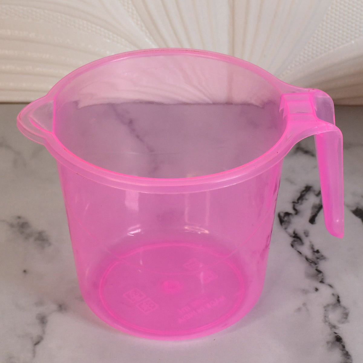 Transparent 1200ml bath water mug from Bathora, ready for use in a clean bathroom.