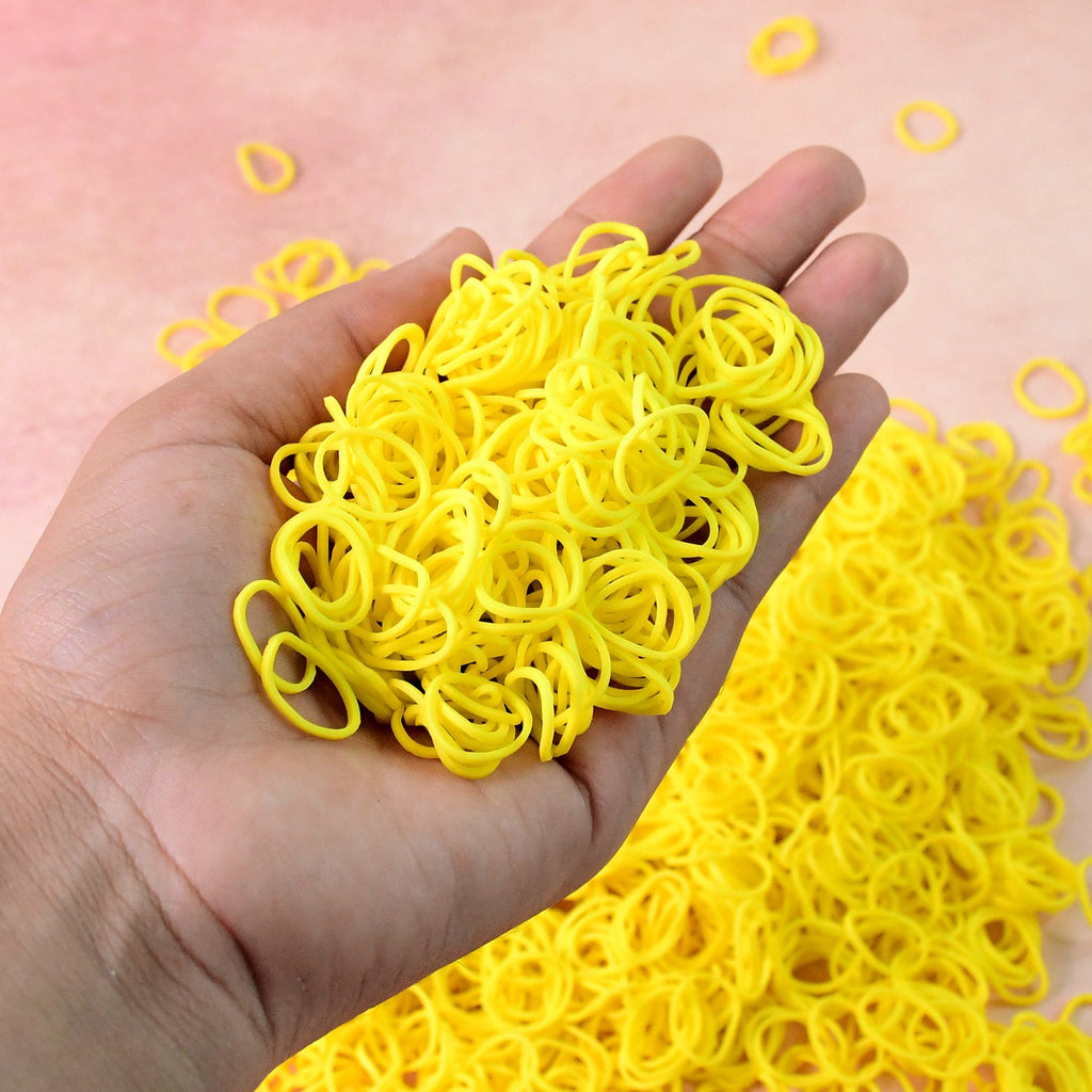 Set of reusable strong elastic rubber bands in orange color