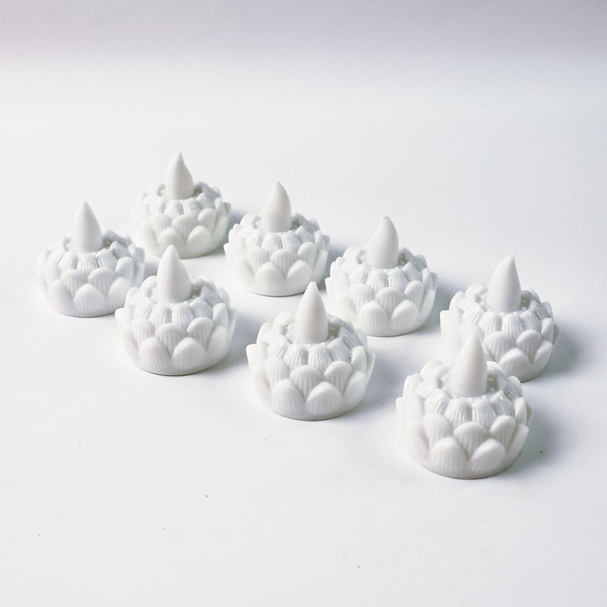 Lotus shaped LED flameless tealight candles used for festive puja decor