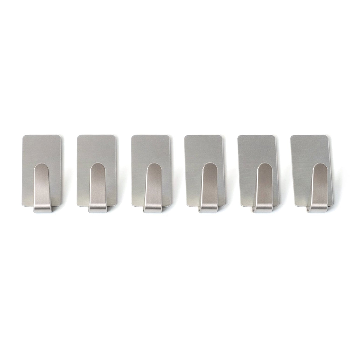 Wall hooks hanging keys and towels in home setting