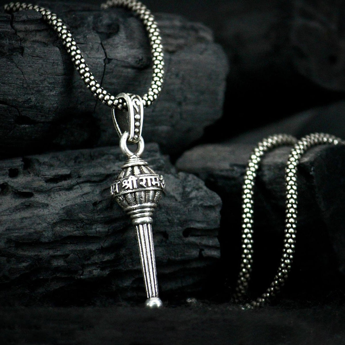 Hanuman Gada Pendant necklace on a plain background, showcasing its silver finish.