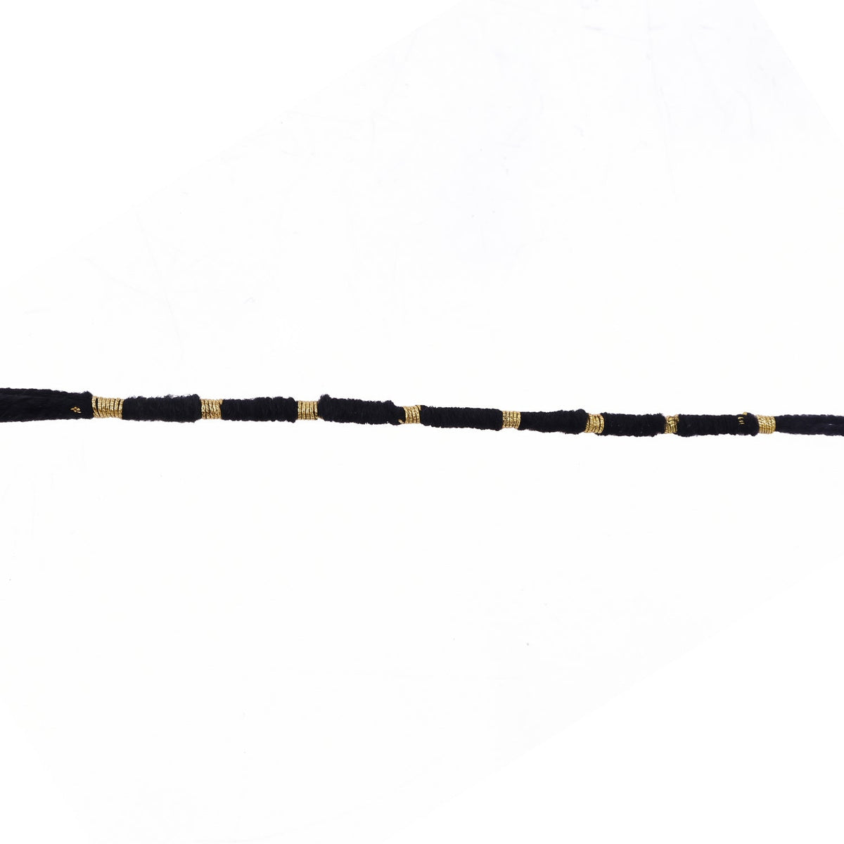 Red Mauli rakhi with gold and pearl details for festival