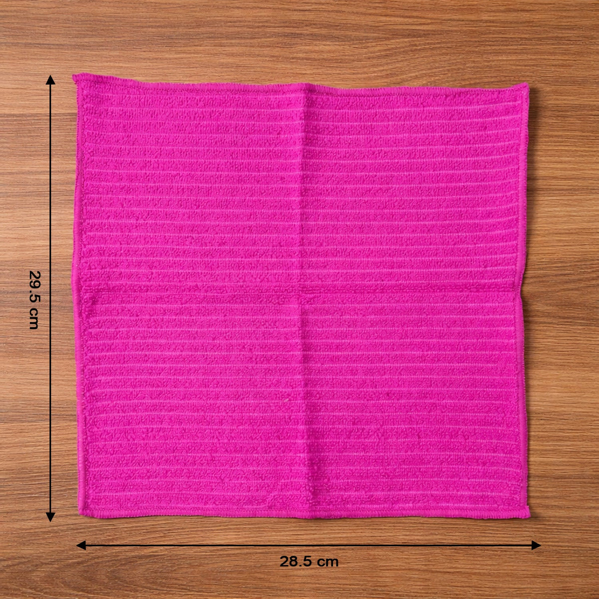 Microfiber cleaning cloth in use wiping a smooth surface