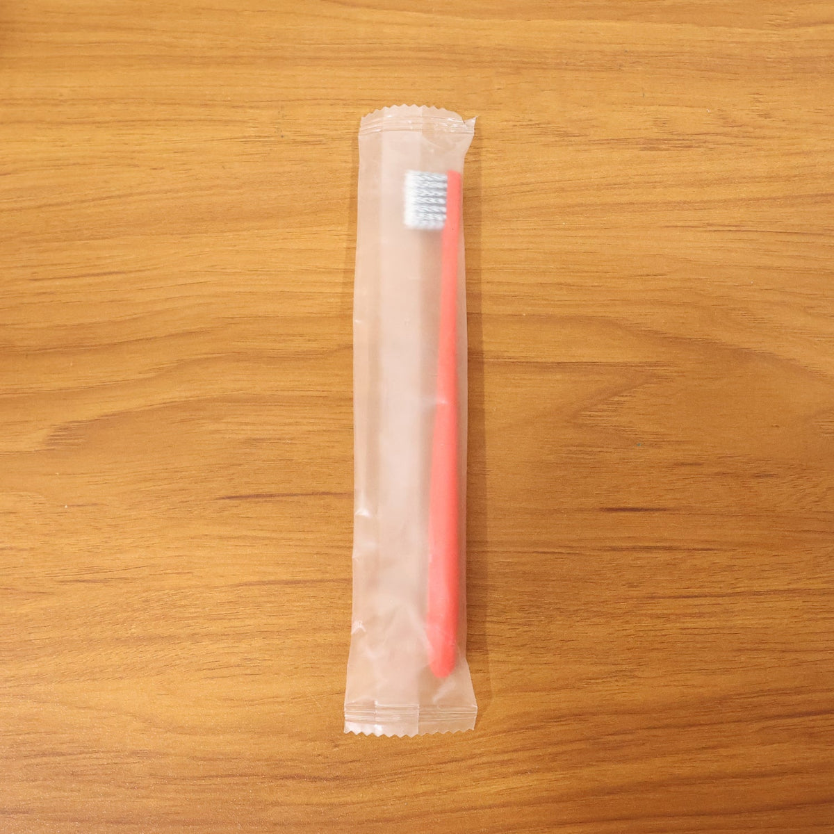 Child-friendly soft bristle toothbrush with ergonomic handle