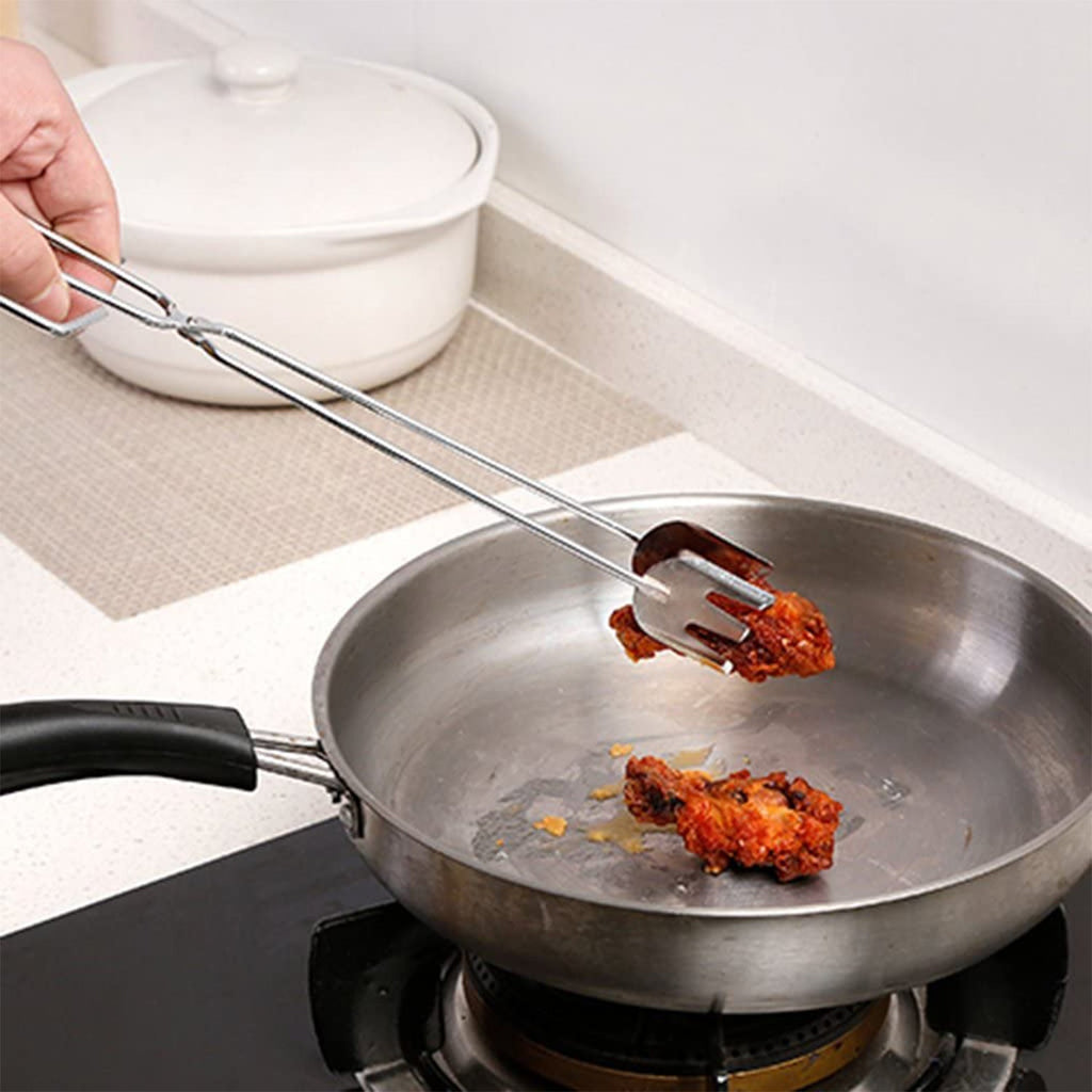 Versatile metal serving tongs holding food items for a picnic.