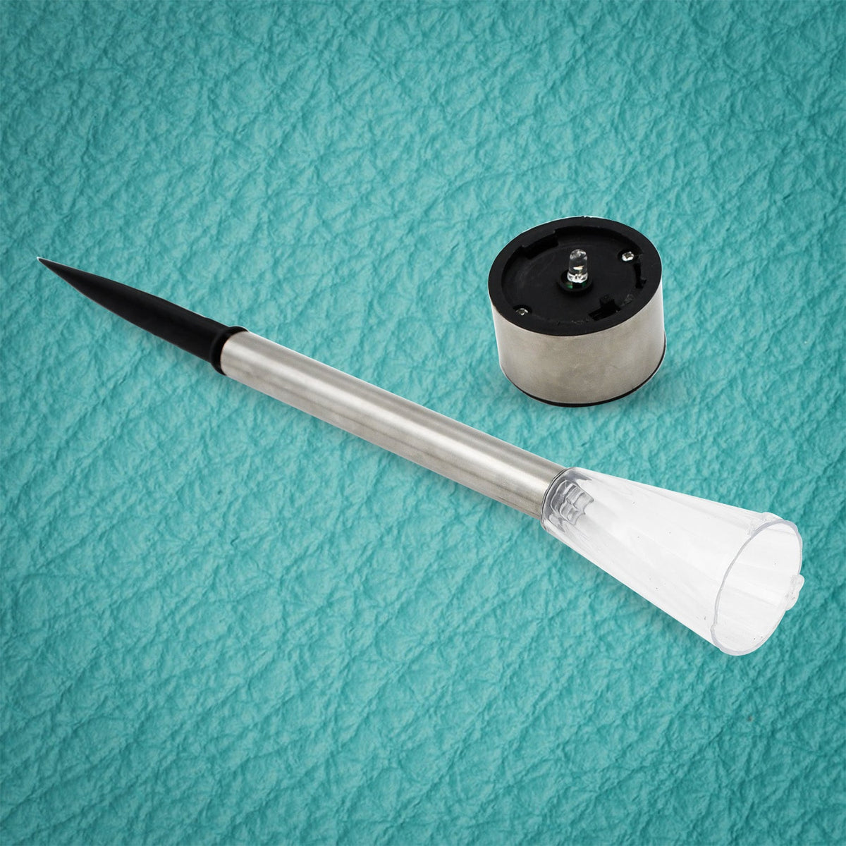 Close-up of a Solar LED Spike Light head with bright LED, perfect for garden and lawn.