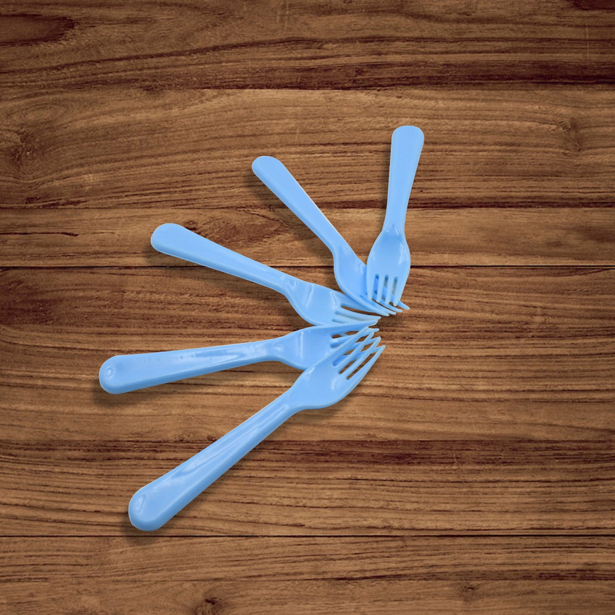 Durable reusable plastic forks, a 5-piece set, ready for various culinary applications.