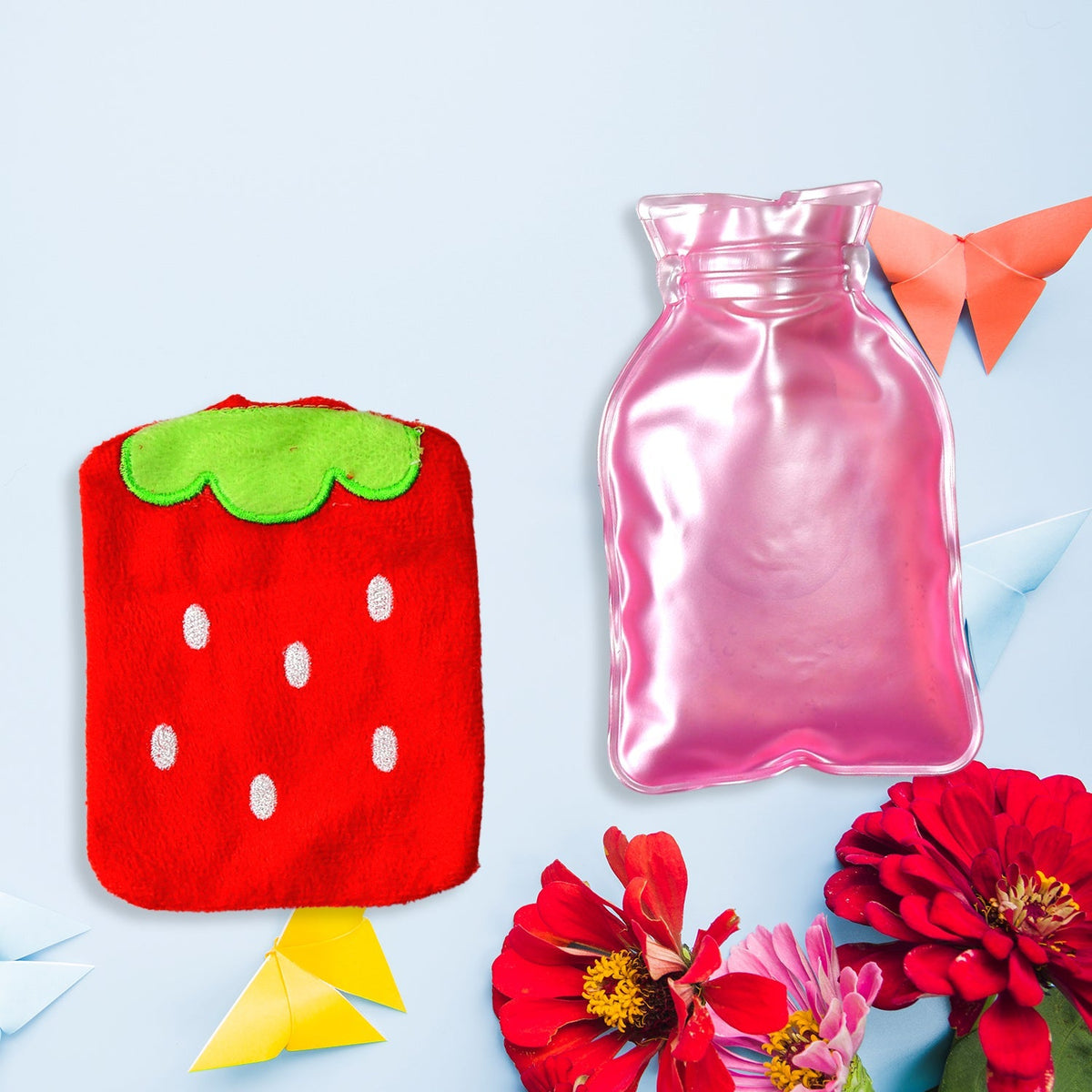 Small hot water bottle with a vibrant strawberry pattern, ideal for targeted warmth.