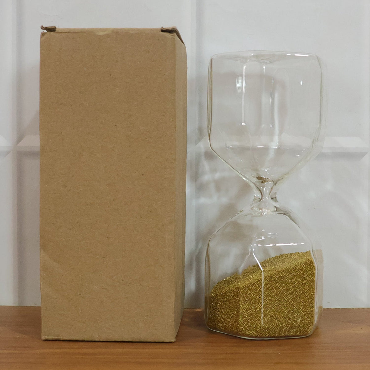 Glass sand timer hourglass on white background