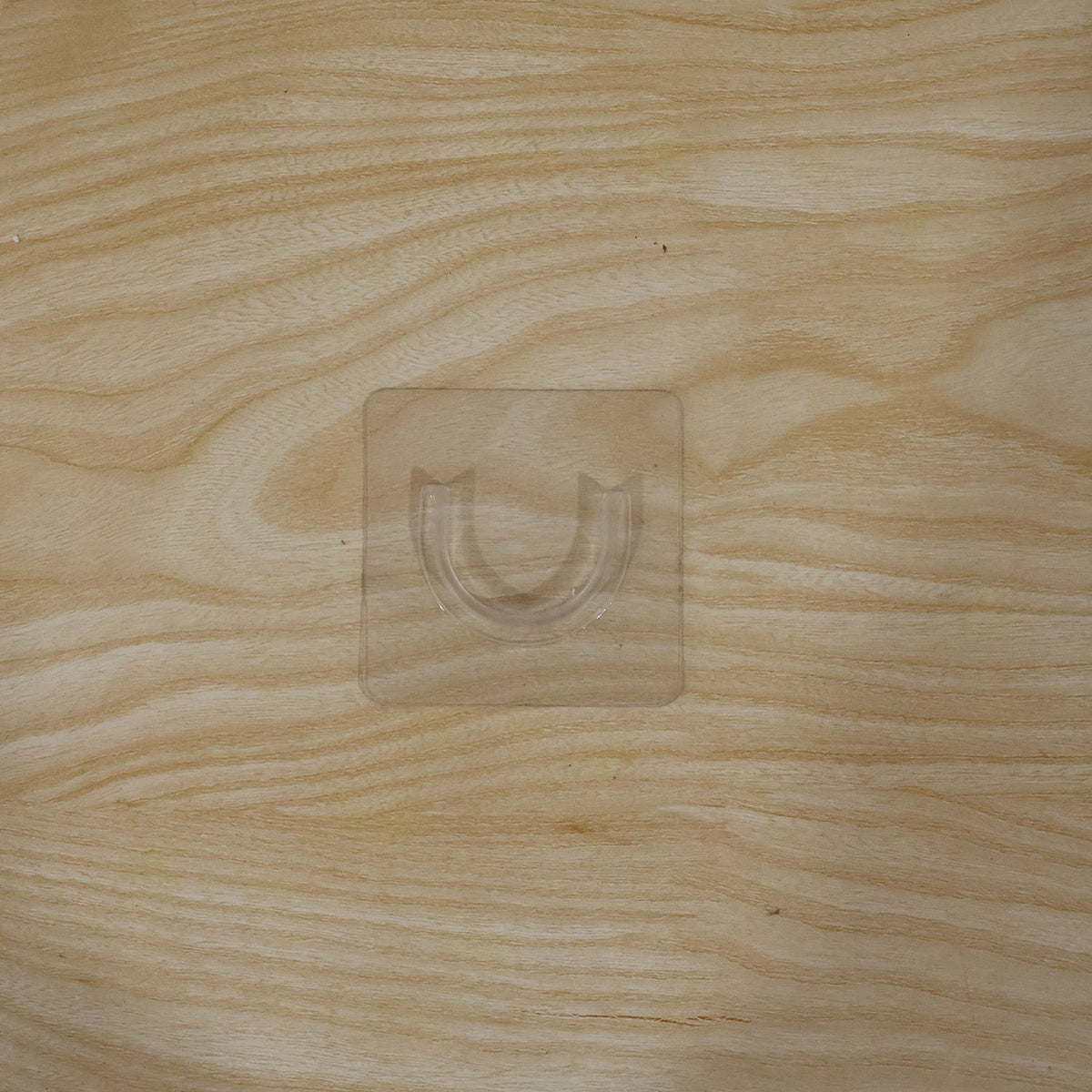 Durable adhesive wall hook for versatile home organization