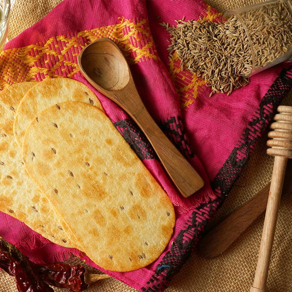 Individual Maniarr's Ragi Mini Millet Snacks pieces, emphasizing their bite-sized nature and millet goodness.