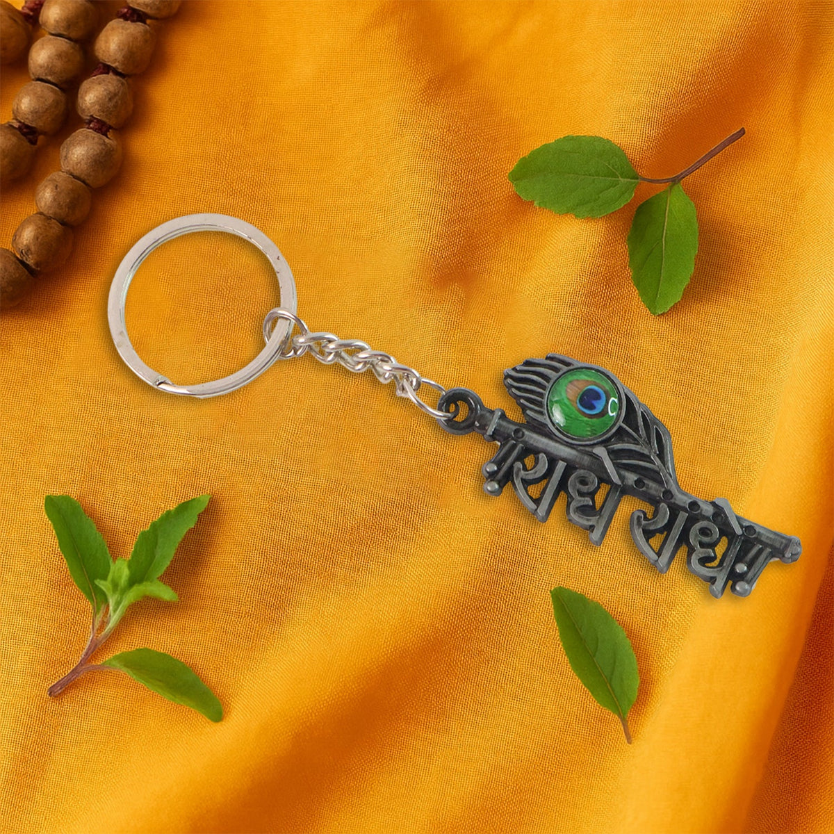 Radha Krishna metal keychain with sturdy ring and chain attached