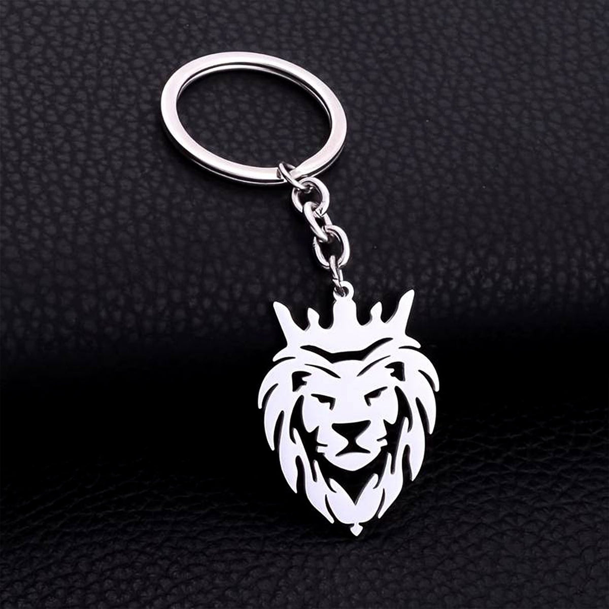 Durable stainless steel lion head keychain with crown design on a white background