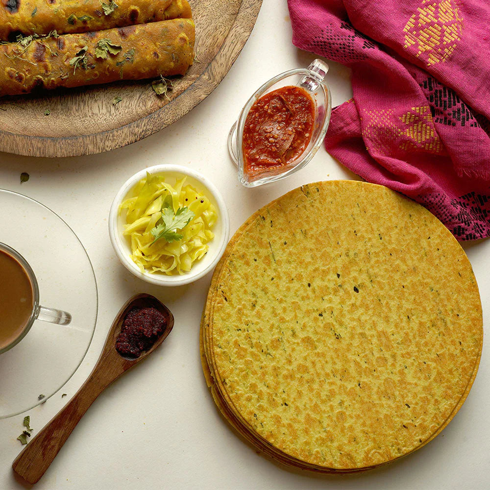 Another view of the crispy round Indian snack, highlighting its golden hue.