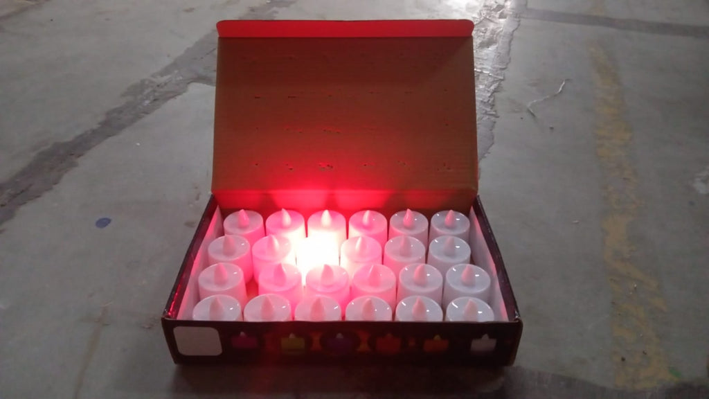 Red LED flameless tealight candles glowing warmly indoors for festive décor