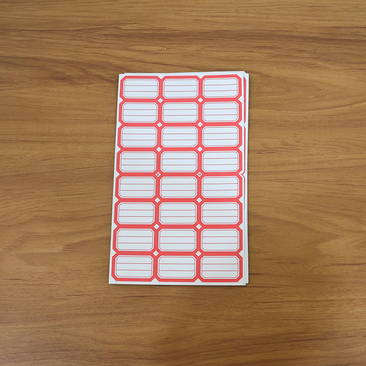 Close-up showing multiple sheets of blank writable self-adhesive shipping label stickers