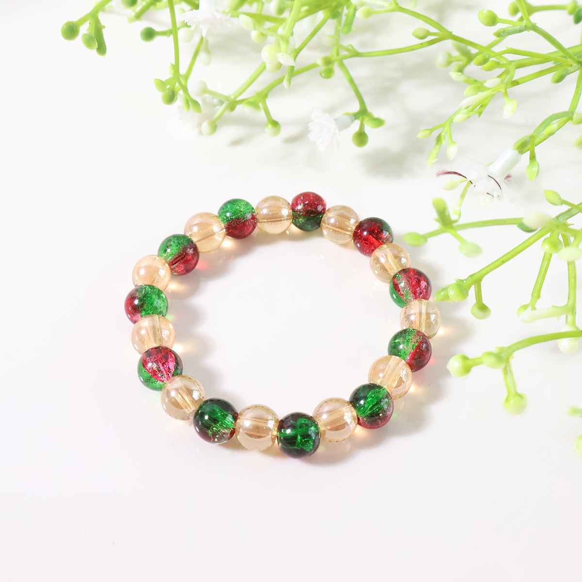 Glossy bead charm detail on multicolor stretch bracelet