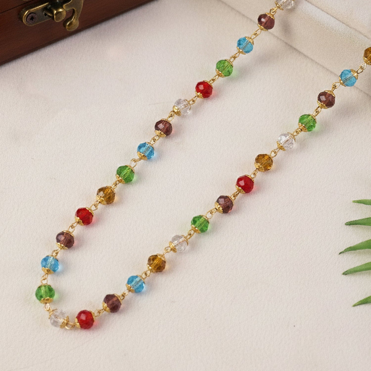 Festive necklace with multicolor crystal beads and gold-tone links
